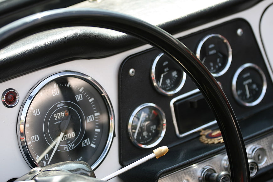 Close-up of vintage car dashboard and steering wheel