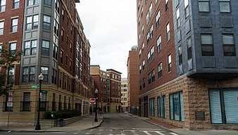 Urban street view between modern brick apartment buildings