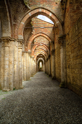 Ancient Gothic Archway Corridor in Italian Abbey Ruins