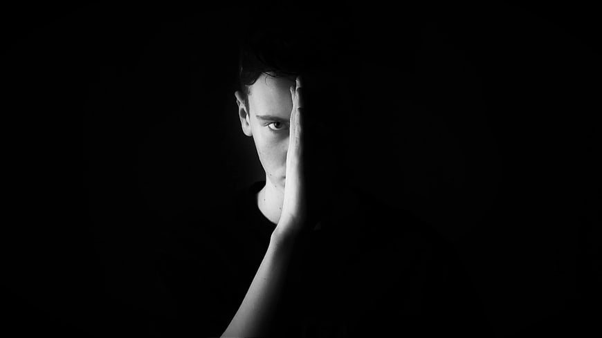 Dramatic Black and White Portrait of Man in Shadows