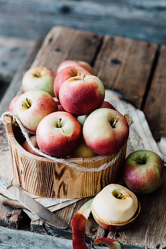 Fresh Red Apples in Rustic Wooden Bucket on Table