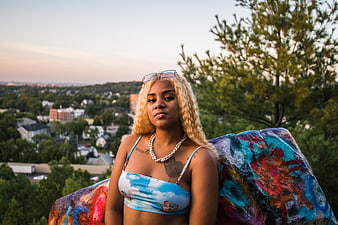 Portrait of Woman with Blonde Hair on Graffiti Rock