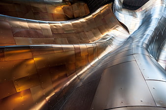 Abstract Curved Metal Architecture with Golden and Silver Panels