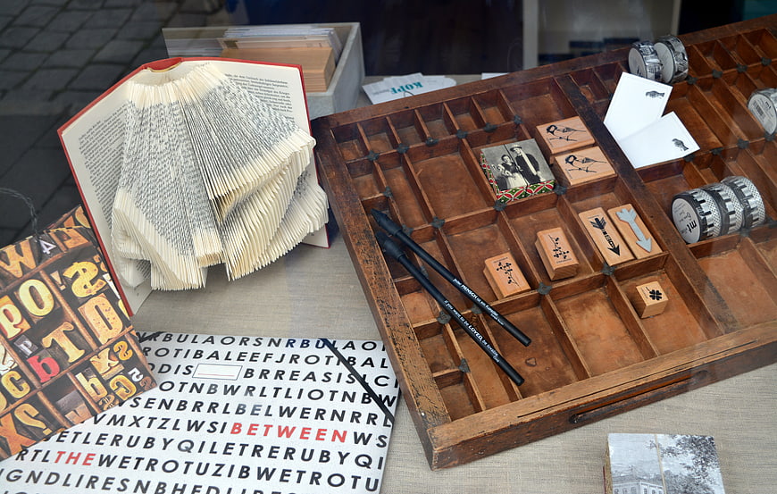 Vintage wooden stamp box with rubber stamps and book art