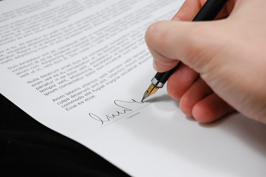 Hand Signing Document with Fountain Pen