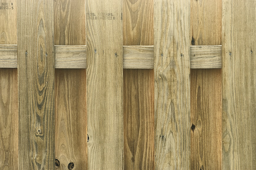 Vertical wooden fence planks with rustic texture and natural grain