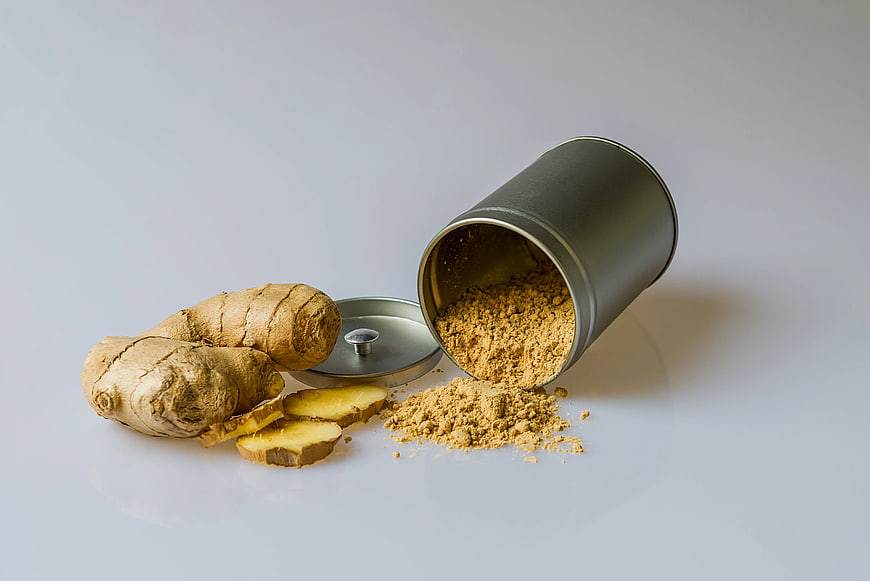 Fresh Ginger Root and Powder Spill from Tin