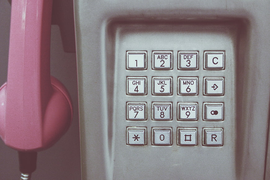 Close-up of vintage pink telephone keypad