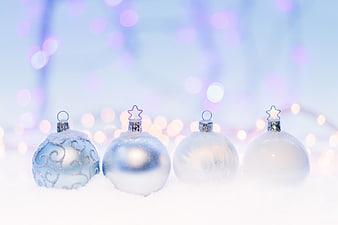 Frosted Blue and White Christmas Ornaments in Snow with Bokeh