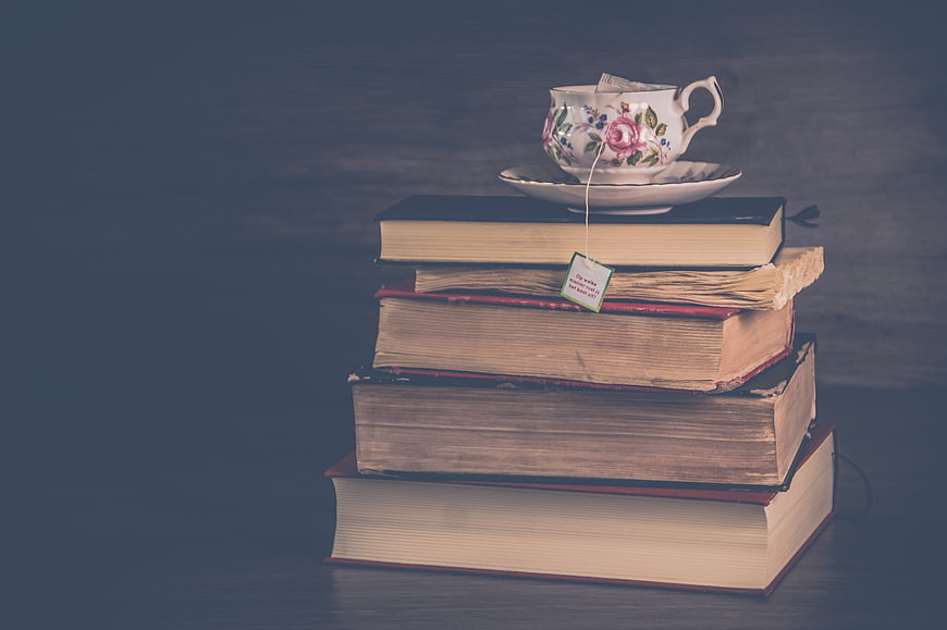 Vintage Books Stack with Floral Tea Cup and Tea Bag