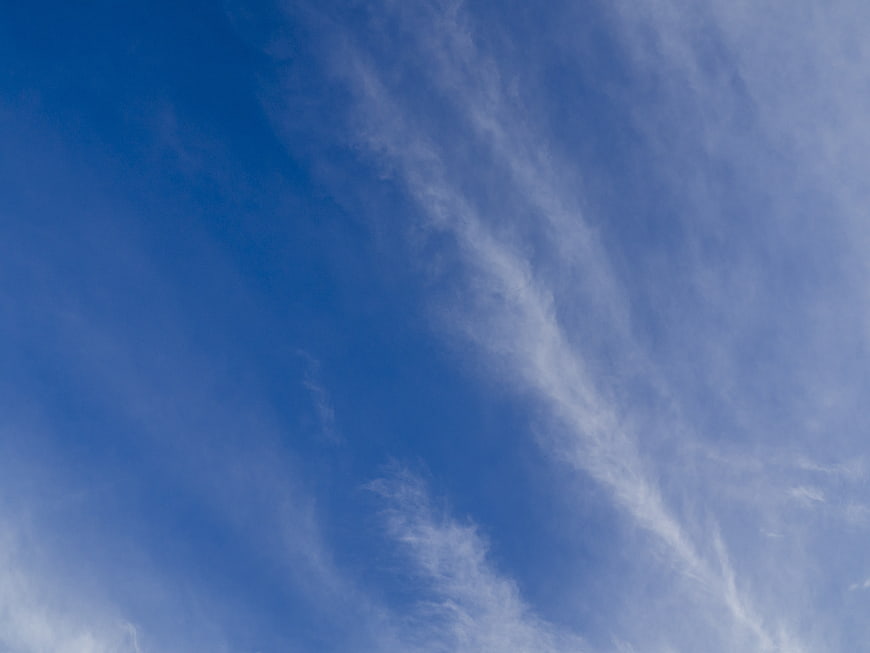 Blue Sky with Wispy Cirrus Clouds Background