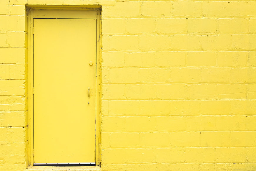 Minimalist Yellow Brick Wall with Matching Door