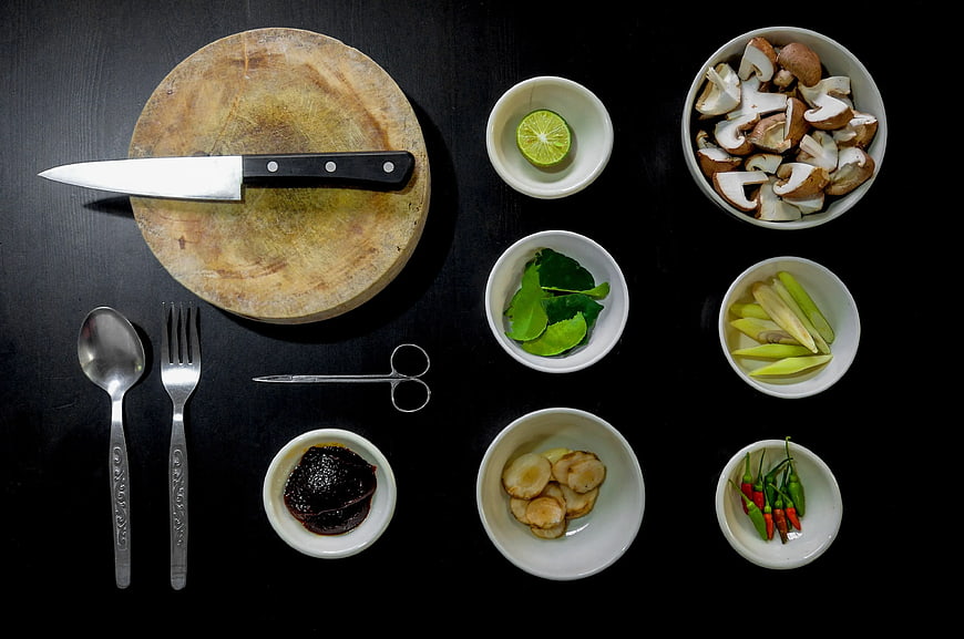 Top View of Thai Cooking Ingredients and Kitchen Tools on Black Background