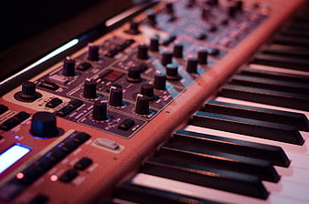 Close-up of Vintage Synthesizer Keyboard and Control Knobs
