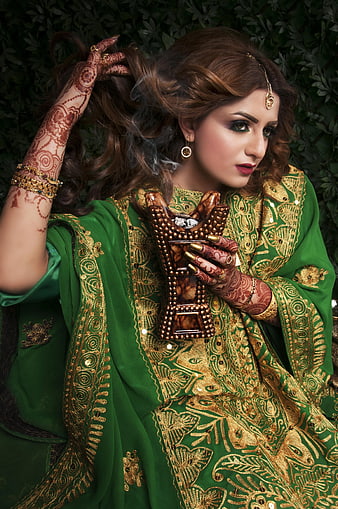 Woman in Green Embroidered Dress with Henna and Incense