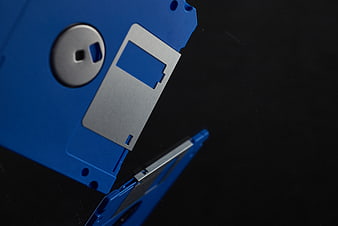 Close-up of blue floppy disk on black background