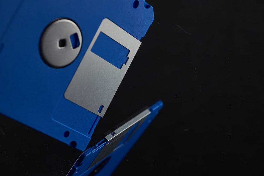 Close-up of blue floppy disk on black background