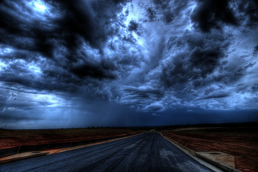 Dramatic Storm Clouds Over Empty Highway Road