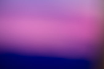 Abstract purple and pink gradient background with soft blur