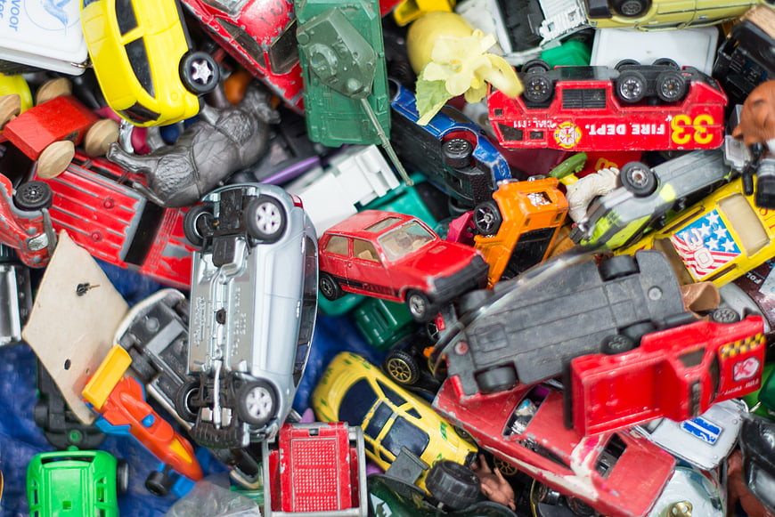 Colorful pile of vintage toy cars and trucks