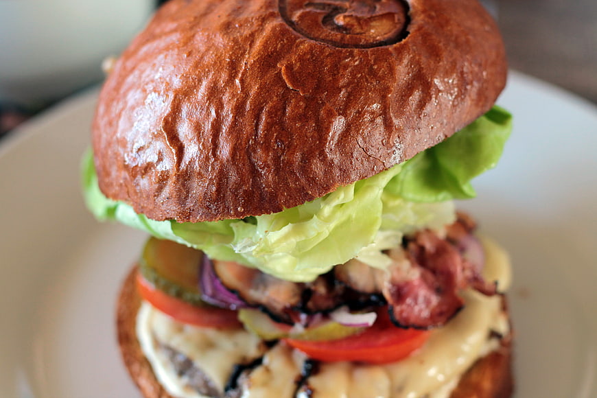Close-up of Gourmet Burger with Lettuce, Tomato, and Cheese
