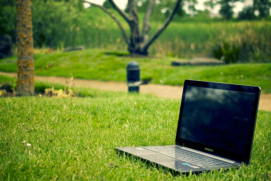 Laptop on Green Grass in Park Outdoors