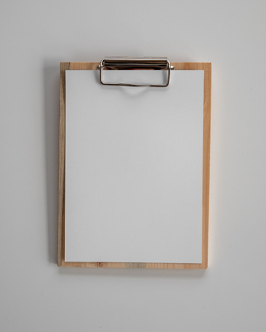 Top View of Wooden Clipboard with Blank Paper on Gray Background