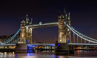 London Tower Bridge illuminated at night with blue lights