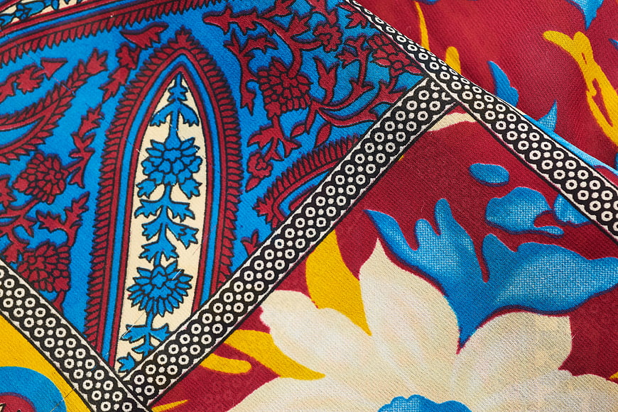 Vibrant Blue and Red Paisley Textile Pattern Close-Up