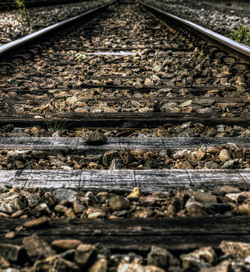 Low angle view of weathered railroad tracks and gravel