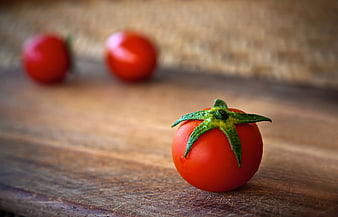 Fresh Red Tomato Close-up on Wooden Cutting Board