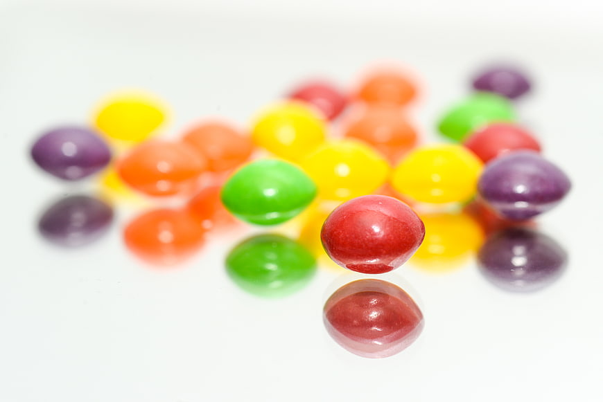Colorful Skittles Candy on White Background