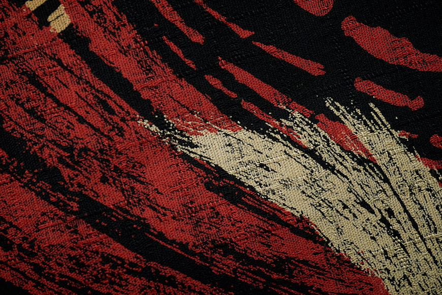 Abstract Red Black and White Textured Fabric Pattern