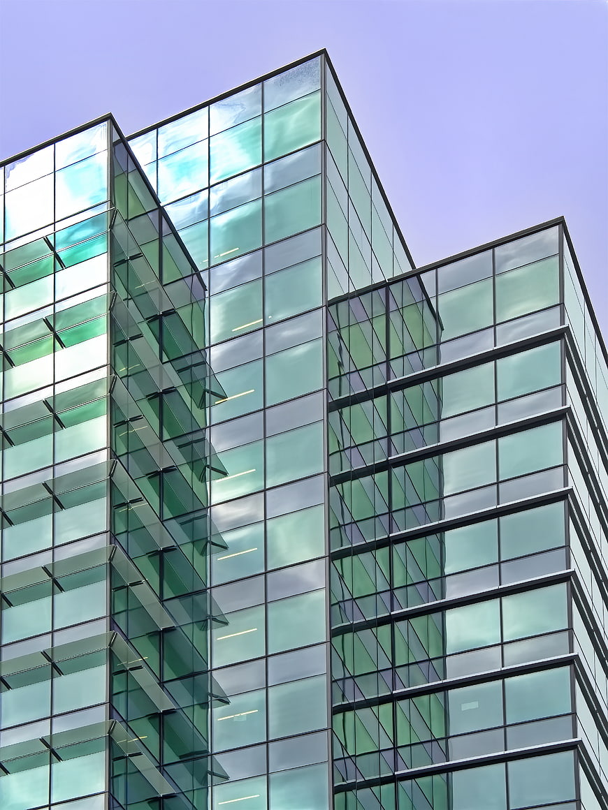 Modern Glass Office Building Facade with Geometric Design