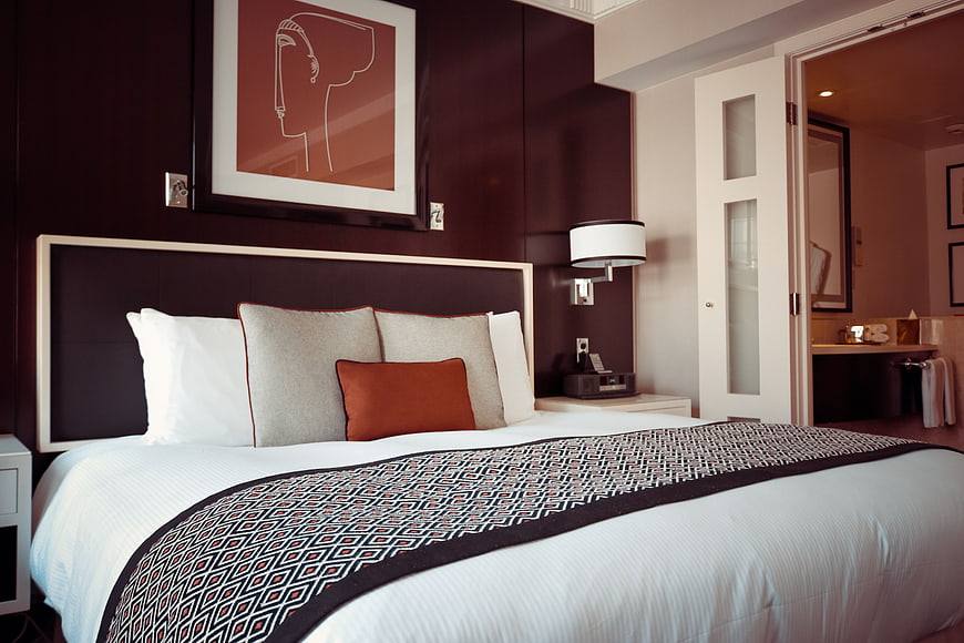 Modern Hotel Bedroom with Dark Accent Wall and Art