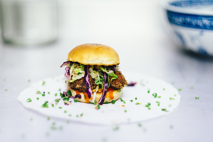 Gourmet Slider Burger with Coleslaw on White Plate