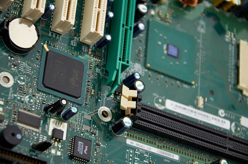 Close-up of green computer motherboard with Intel chip