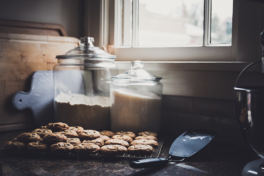 Homemade chocolate chip cookies cooling on kitchen counter