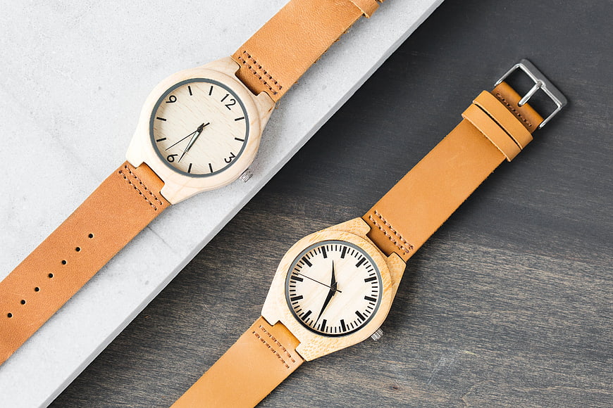 Minimalist Wooden Watches with Leather Straps on Marble and Wood