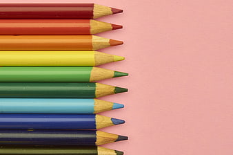 Colorful Pencils Arranged on Pink Background with Copy Space