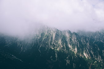 Misty Mountain Peaks Shrouded in Clouds