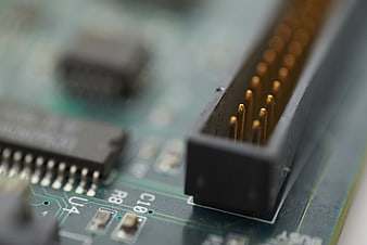 Close-up of electronic circuit board connector and chip