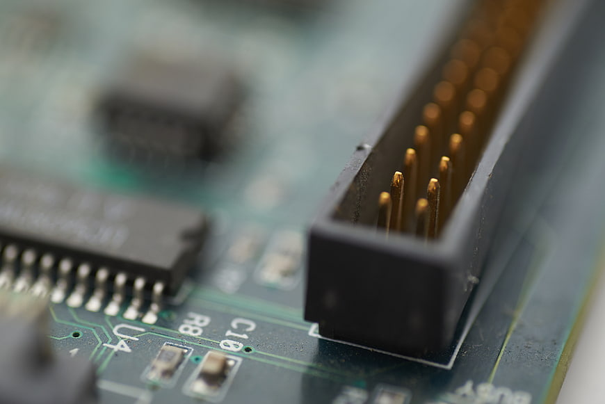 Close-up of electronic circuit board connector and chip
