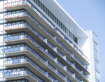 Modern Apartment Building Facade with Glass Balconies
