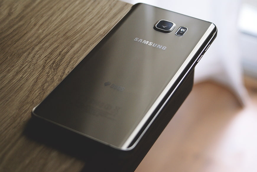 Gold Samsung Galaxy S6 Edge Plus on Wooden Table