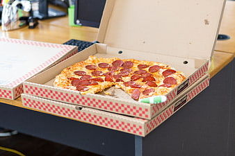 Pepperoni Pizza in Box on Office Desk