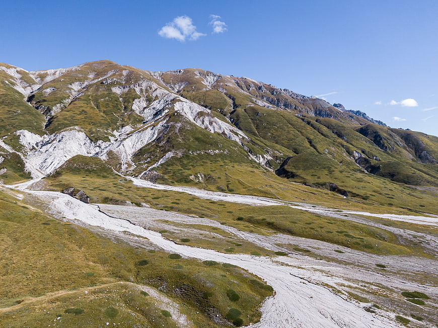 Scenic Alpine Mountain Landscape with Rocky Slopes and Blue Sky