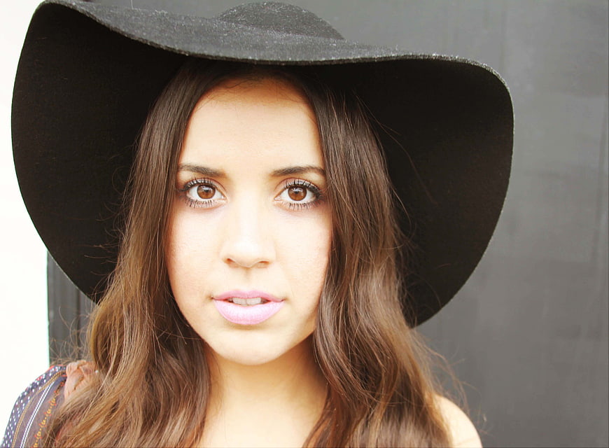 Portrait of Woman in Black Cowboy Hat