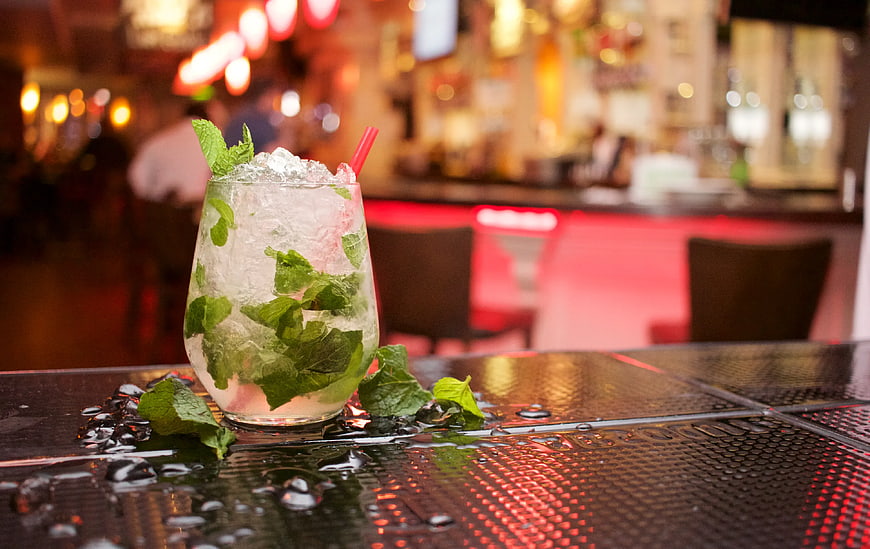 Refreshing Mojito Cocktail on Wet Bar Table