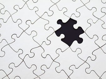 White Jigsaw Puzzle with Missing Piece Concept